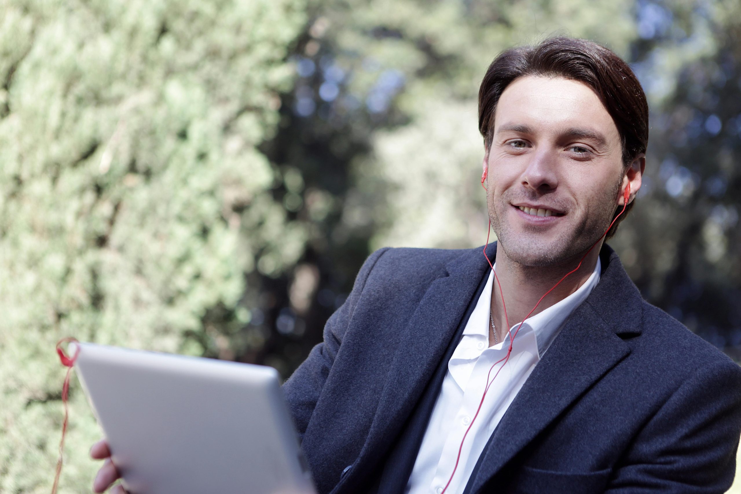 Data analyst using job title generator on laptop to enhance resume visibility.